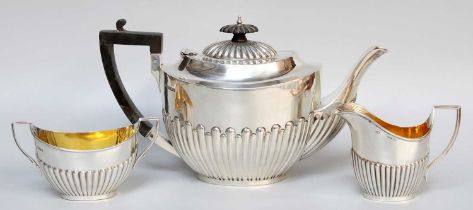 A Three-Piece George V Silver Tea-Service, Sheffield, 1910 and 1911, each piece part-fluted oval,