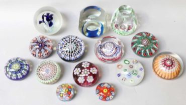 Fourteen Assorted Glass Paperweights, including a Perthshire example set with silhouetted canes on a