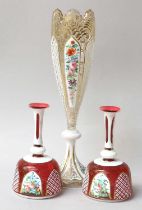 A Bohemian White Overlay Glass Pedestal Vase, late 19th century, with gilt foliage and enamelled