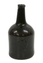 A Sealed Wine Bottle, dated 1772, of cylindrical form with sloping shoulders, the seal inscribed T