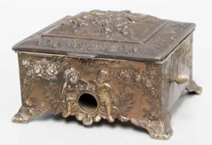 A Japanese Relief Work Metal Cigarette Dispenser, decorated with putti and on bracket feet, 9.5cm