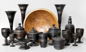 A Collection of Turned Ebony Holloware Vessels, 19th century, including vases,egg cups, goblets