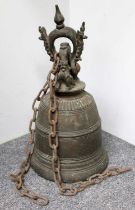 A 19th-century Indian Bronze Temple Bell, the suspending loop adorned with mythical beasts, the main