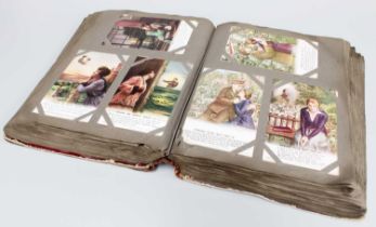 An Antique Postcard Album, with 120 Sets of Bamforth & Sons Postcards