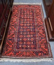 A Mashad Baluch Rug, the honeycomb lattice field of hooked devices enclosed by geometric latchook