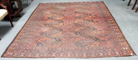 An Ersari Carpet, circa 19th Century, the abrashed madder field with two columns of gulli guls