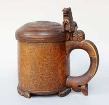 A Norwegian Birch Peg Tankard, 19th century, the domed cover carved with a lion roundal, the