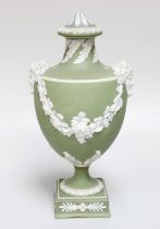 A Wedgwood Green Jasperware Urn and Cover, early 19th century with twin Baccus mask handles and with