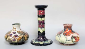 A Modern Moorcroft Pottery Candlestick, "Violets" pattern by Sally Tuffin, impressed marks, 21cm