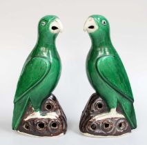 A Pair of Chinese Porcelain Models of Parrots, Kangxi style, green glazed and on pierced rockwork