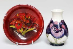 A Moorcroft Pottery Vase, "Big Poppy" pattern on a cream gound, impressed and signed, 15cm high,