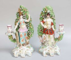 A Pair of Sampson of Paris Porcelain Figural Candlesticks,19th century after Chelsea, modelled as