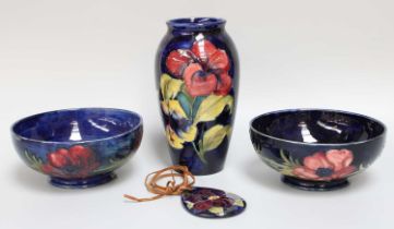 A Walter Moorcroft Pottery Vase, "Hibiscus" pattern, 19cm high, together with two "Anemone" bowls