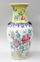 A Chinese Porcelain Baluster Vase, Qing Dynasty, with twin mask and loop handles, yellow ground