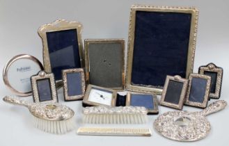 A Collection of Assorted Elizabeth II Silver Photograph-Frames, various shapes and sizes; Together
