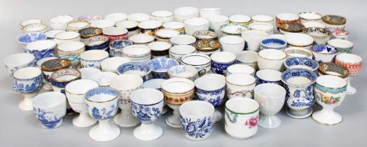 A Collection of Approximately Ninety Pottery and Porcelain Eggcups, including Spode, Masons,