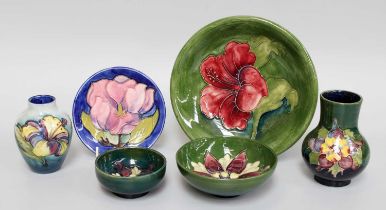 A Walter Moorcroft Small Pottery Vase, "Hibiscus" pattern on a two tone blue grouns, paper label,