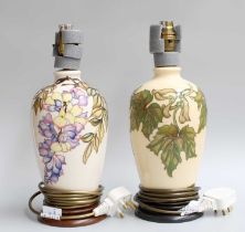 Two Modern Moorcroft Pottery Table Lamps, both cream ground, one decorated in the "Wistful"