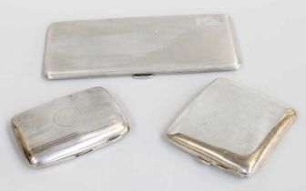 Three Silver Cigarette-Cases, one oblong, overall engine-turned and engraved with initials,