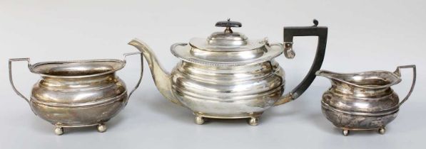 A Three-Piece George V Silver Tea-Service, by William Hutton and Sons, Sheffield, 1921, in the