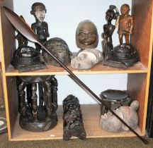 A Collection of African Tribal Art, comprising three various masks, two Makonde and three other