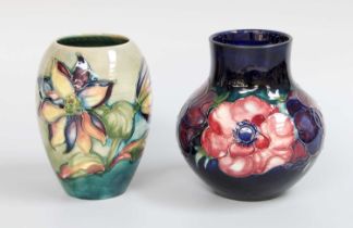 A Walter Moorcroft Green Ground Vase, together with a blue ground clematis vase (2) Green Ground