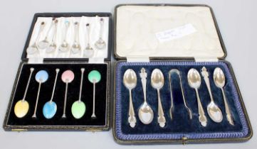 Two Cased Sets of Six Silver Teaspoons, one set with enamelled bowls and one set cased with a pair