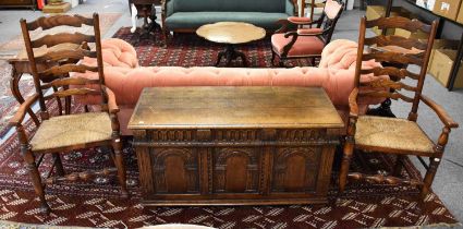 A Titchmarsh & Goodwin Oak Blanket Box, the three panels ornately carved with archways, 117cm by