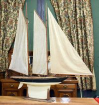 A Large Handmade Wooden Pond Yacht, with three masts, sails and rigging, with painted hull and deck,