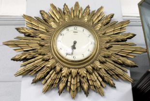 A Smith's Gilt Sun Burst Wall Timepiece, 68cm wide Movement in going order, no key present