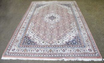 An Indian Carpet, the soft candy pink field with central medallion, framed by spandrels and ivory