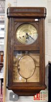 A 1920's Oak Cased Chiming Wall Clock, 79cm high