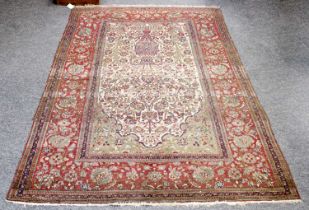 Isfahan Prayer Rug, the ivory field with urn issuing flowers, enclosed by brick red borders, 206cm