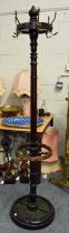 A Late Victorian Mahogany Coat Stand, the brass hooks with lion masks, 186cm high Base is broken and