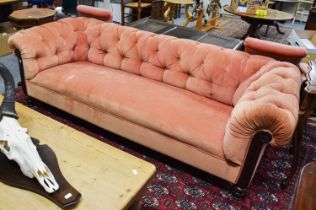 A Victorian Chesterfield Sofa, with buttoned pink upholstery, 220cm by 85cm by 67cm