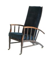 An Arts & Crafts Stained Beech Reclining Armchair, slatted back, the arms supported by bobbin