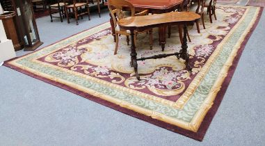 A Large Machine Made Carpet of Savonnerie Design, 606cm by 330cm.