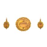 A Victorian Citrine Brooch and Matching Drop Earrings, circa 1850 the oval citrines in yellow rubbed