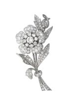 A Diamond Brooch/Pendant realistically modelled as a floral spray, set throughout with round