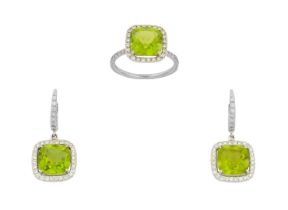 A Peridot and Diamond Cluster Ring and A Pair of Matching Drop Earrings the cushion cut peridot