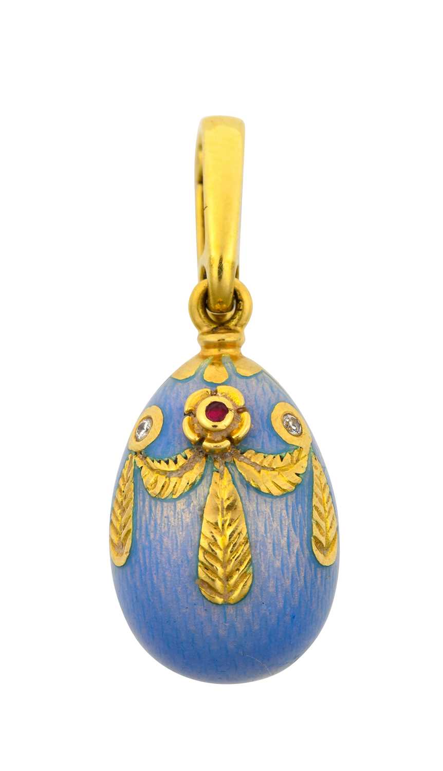 An Enamel Egg Pendant, by Victor Mayer for Fabergé enamelled front and back in blue, with a yellow