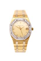 Audemars Piguet: An 18 Carat Yellow and White Gold Calendar Centre Seconds Quartz Wristwatch, signed