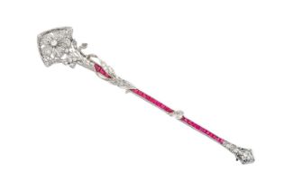 An Early 20th Century Ruby and Diamond Brooch the tapered bar inset with calibré cut rubies in a