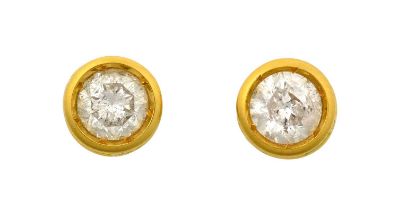 A Pair of 18 Carat Gold Diamond Solitaire Earrings the old cut diamonds in yellow rubbed over