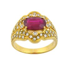 A Ruby and Diamond Ring the oval cut ruby in a yellow claw setting, with round brilliant cut