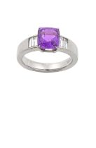 A Purple Sapphire and Diamond Ring the cushion cut purple sapphire in a white claw setting, to pairs