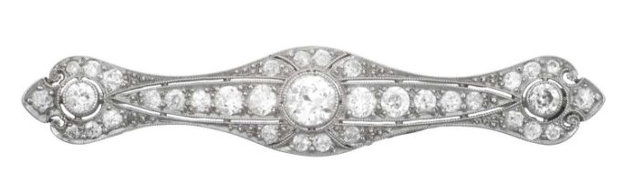 An Art Deco Diamond Brooch three old cut diamonds conjoined by a tapered bar set throughout with old