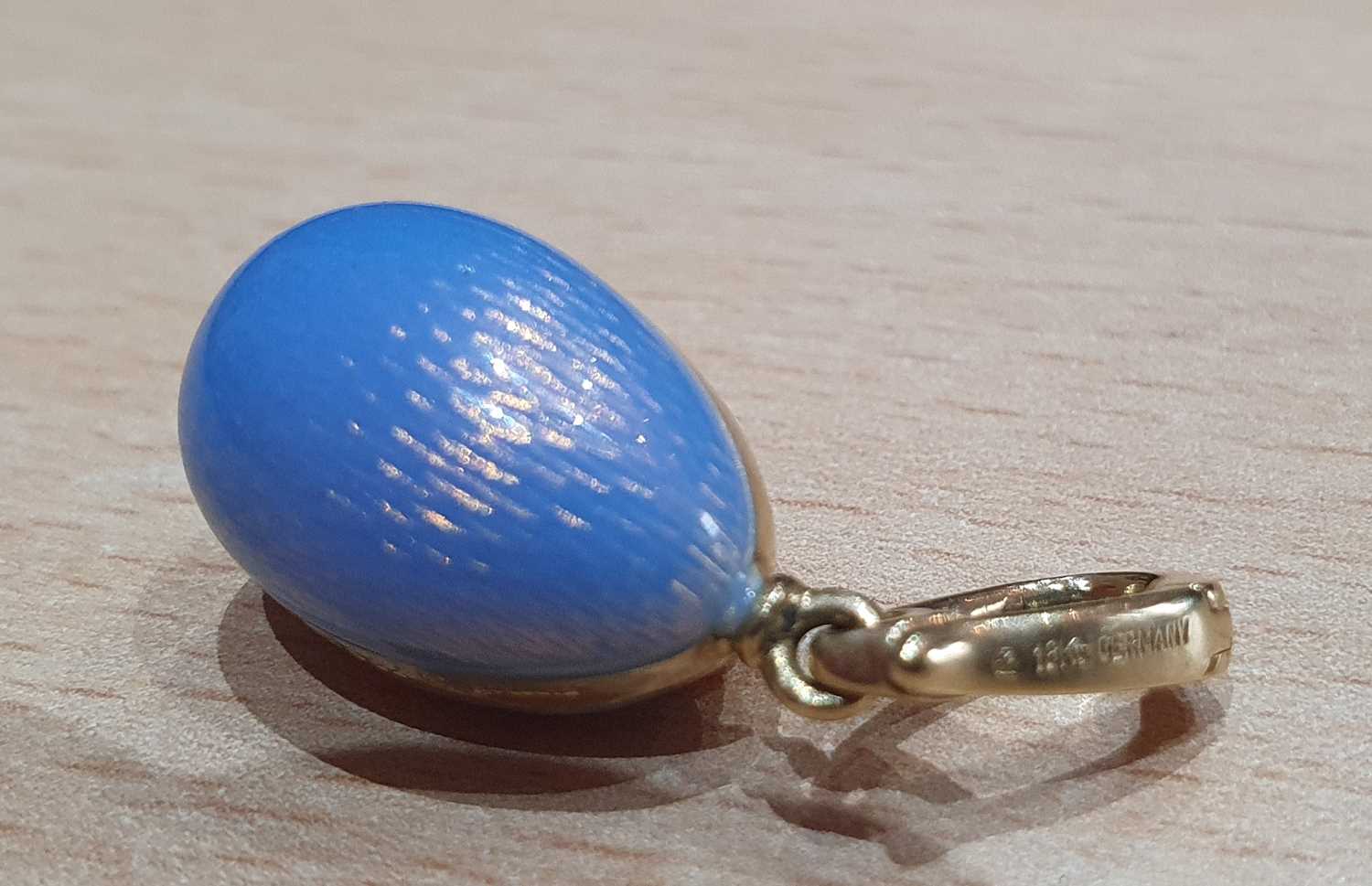 An Enamel Egg Pendant, by Victor Mayer for Fabergé enamelled front and back in blue, with a yellow - Image 5 of 7