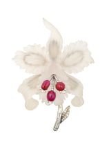 An Austrian Rock Crystal, Ruby and Diamond Brooch realistically modelled as an orchid, the carved