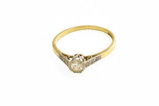 A Diamond Solitaire Ring, the round brilliant cut diamond in a white claw setting, to diamond set